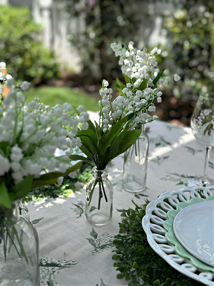 lily of the valley in a transparent glass vase 